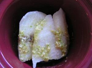 Layered filets of Tilapia and seasoning